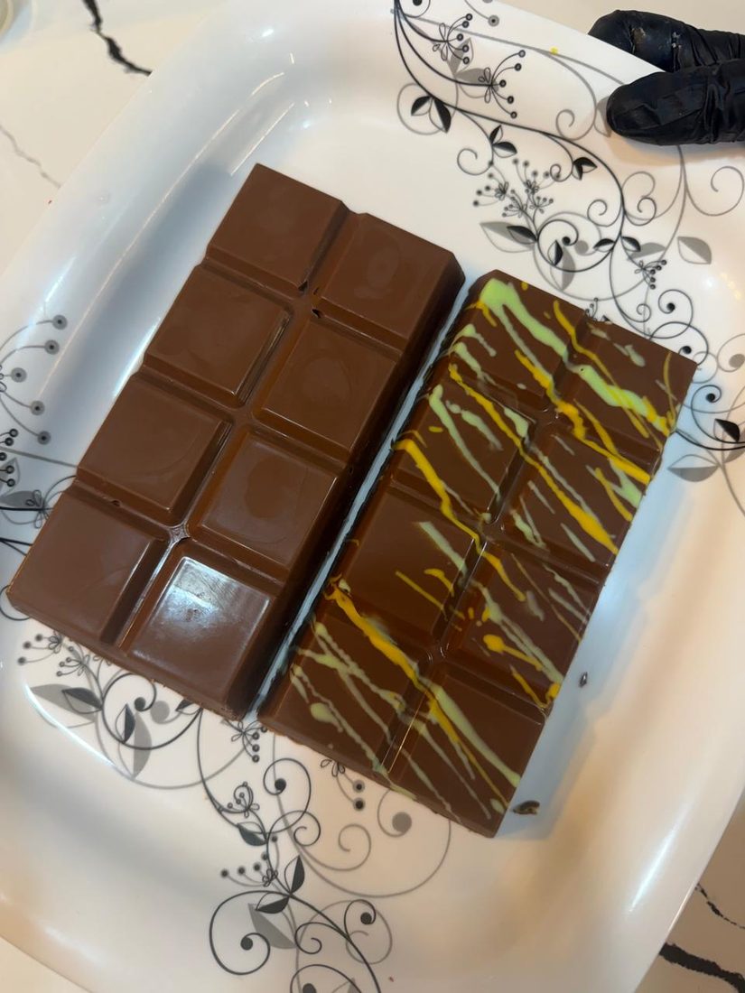 A sliced kunafa bar with pistachio filling