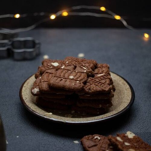 Biscoff chocolate bites on a dark plate