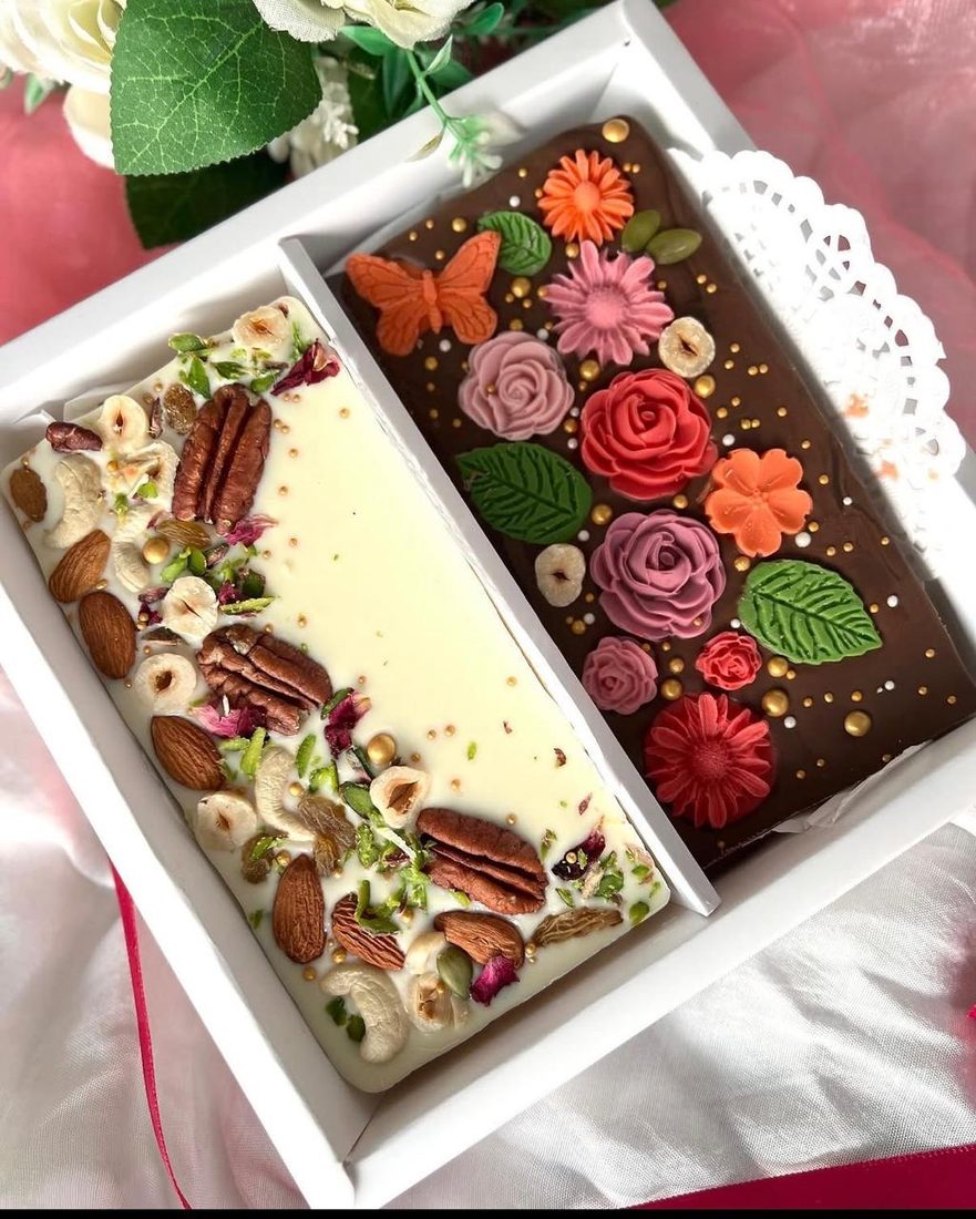 A customised bar decorated with sugar roses, pecans and pistachio